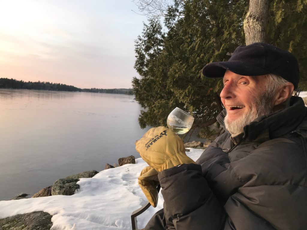 man with wine glass outside snow and ice