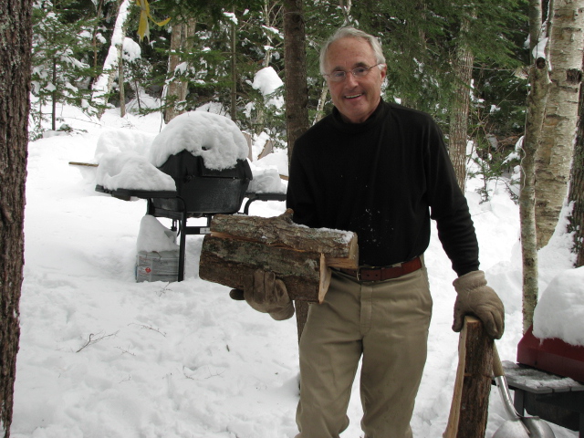 man holding firewood